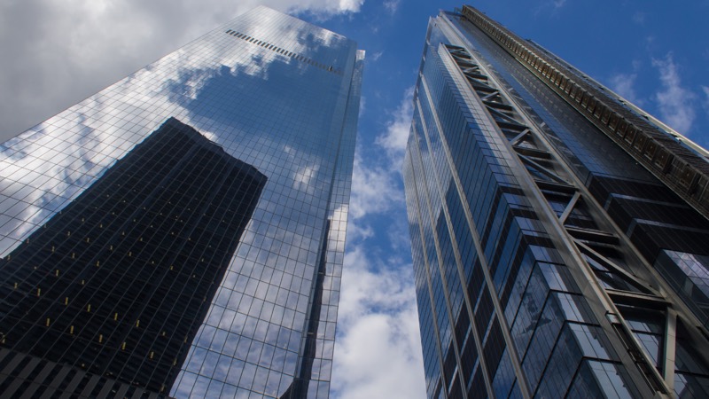 Glass office towers seen from street level
