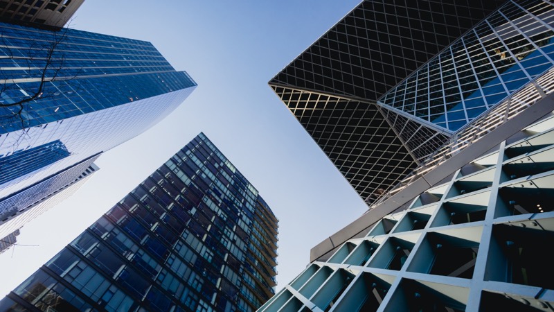 Skyscrapers converging overhead in an international financial district